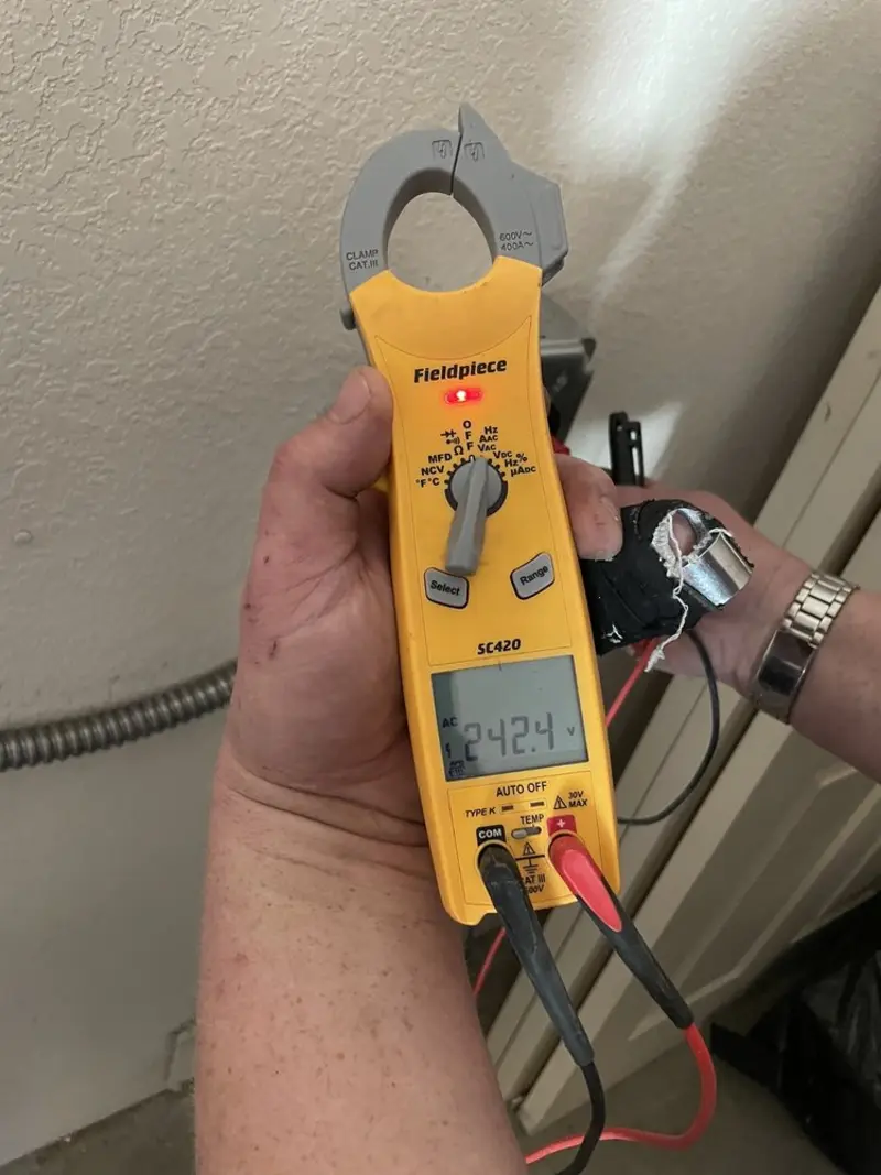 Voltage testing with clamp meter during Recessed Lighting Installation in Killingworth